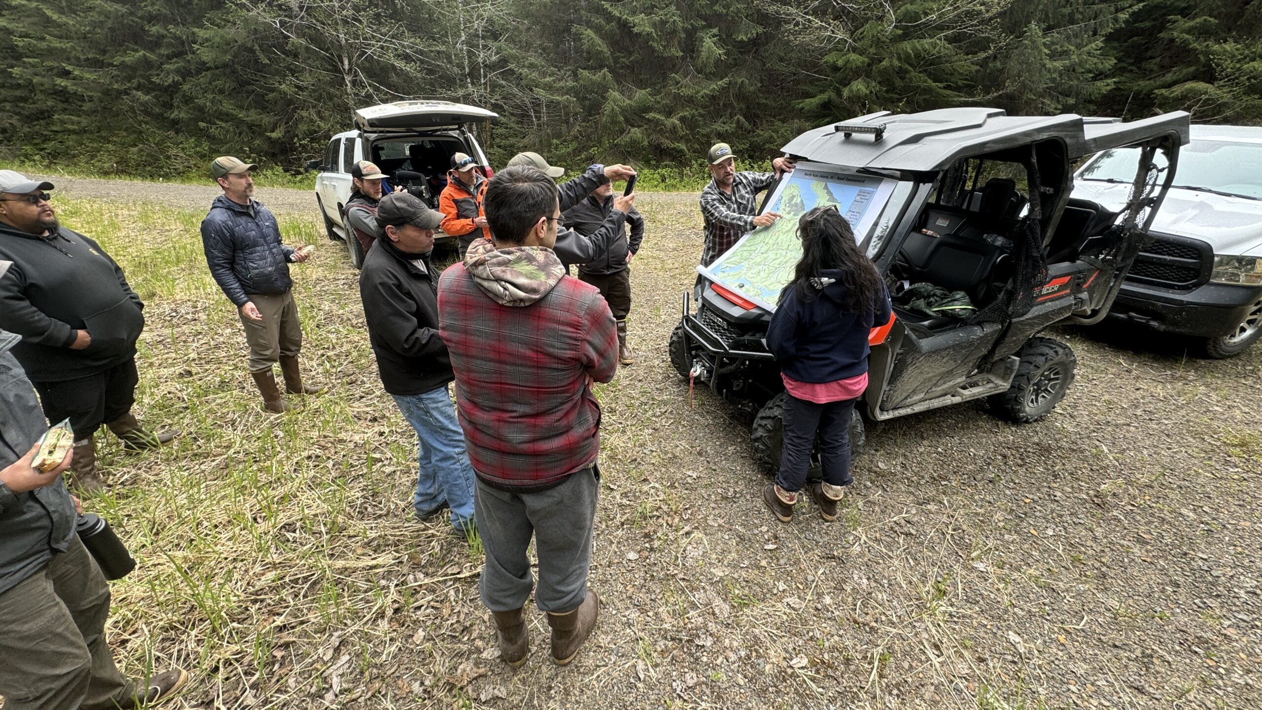 This is a photo of people from Kake working with the USFS on Kuiu road planning in the field.